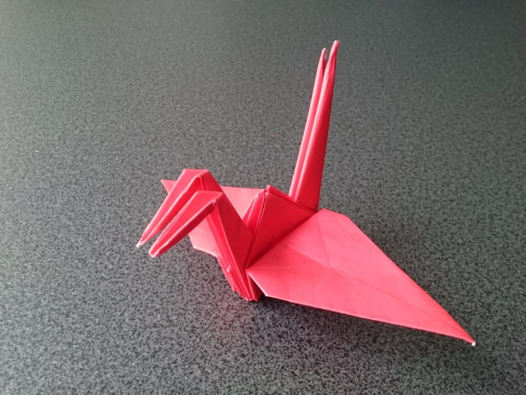 鶴連坊さんによる比翼の鳥（不切正方形一枚折り）の折り紙